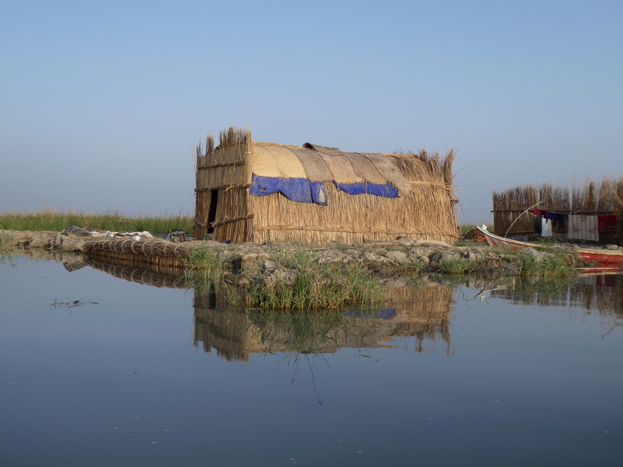A traditional Marsh Arab home, built in the same style used by the ancient Sumerians. It floats atop the Mesopotamian Marshes. Photo by Erica Gies.