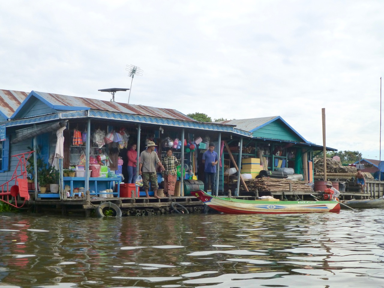 Floating store on Tonle Sap, Southeast Asia's largest freshwater lake, home to thousands of dispossessed people. The lake faces numerous threats, including a dam-building boom in China and Laos. Photo by Erica Gies.